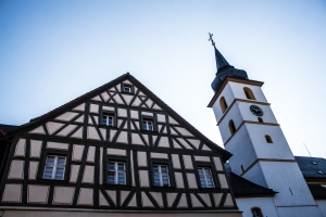 Half-timbered house with church